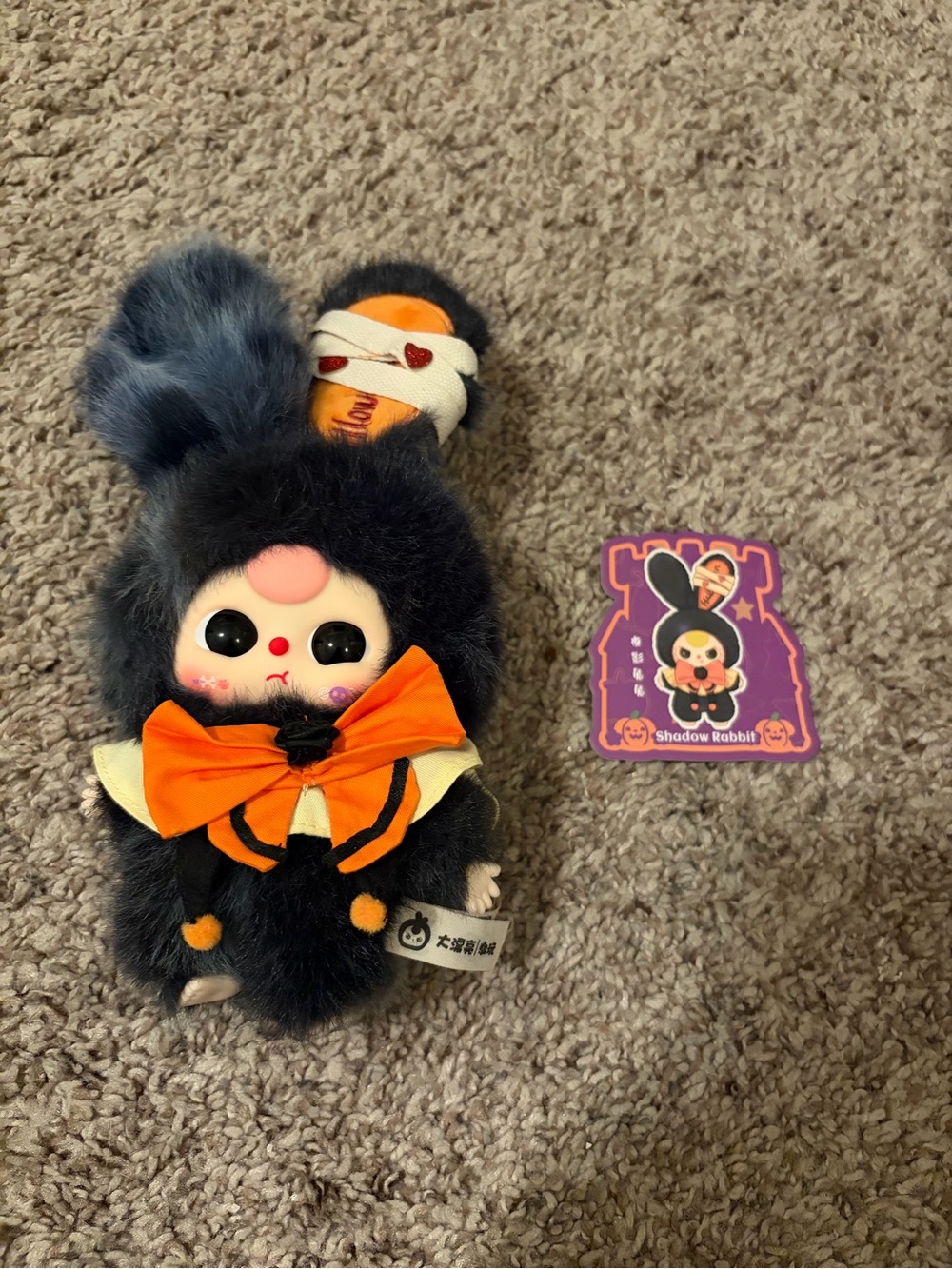 Shadow Rabbit Plush Keychain with Orange Bow Accent